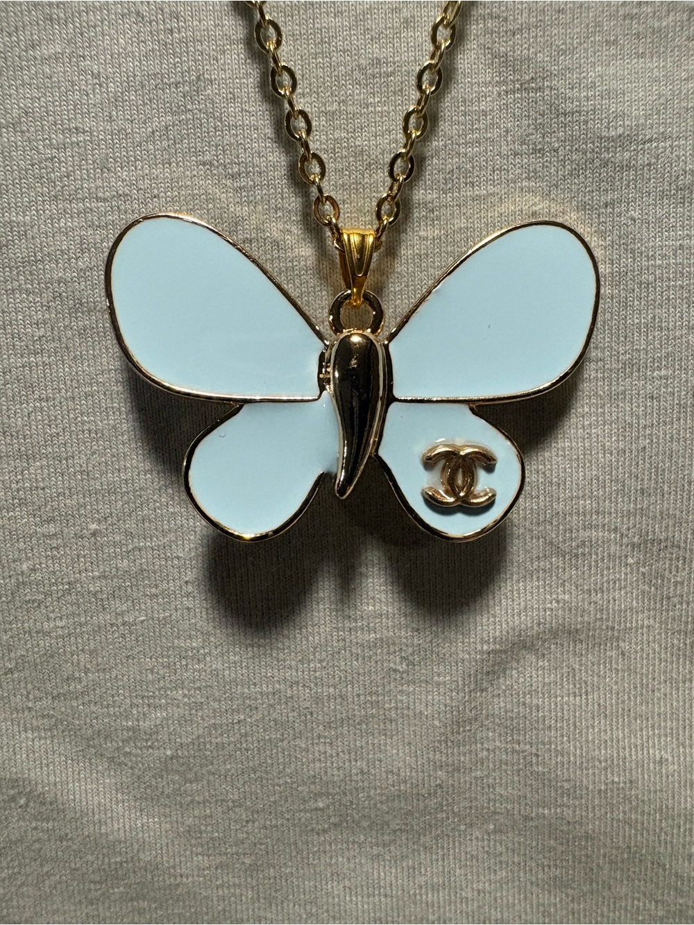 CHANEL Gold-Tone Butterfly Pendant Necklace with Light Blue Enamel